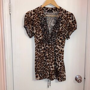 Heartsoul Animal print top with deep v neck with rouching around the v.